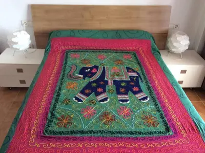 a bed with a rug on top of it at Valencia, villa, piscina privada, junto A-7 cerca de playas, aeropuerto, Cheste in Torrent