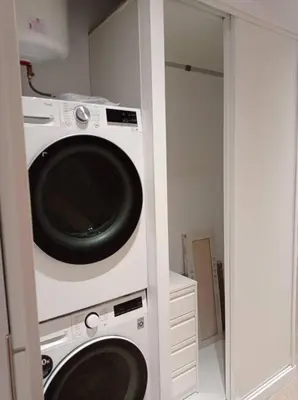 a laundry room with a washer and dryer at Cozy Retreat in Heart of Valencia Perfect for Couples n Families in Valencia