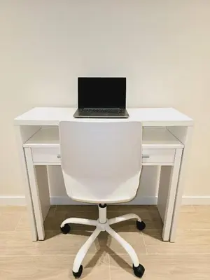 a white desk with a laptop on top of it at Cozy Retreat in Heart of Valencia Perfect for Couples n Families in Valencia