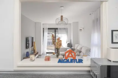 a living room with a large window in a room at Espacio-1, 2-H in Cullera