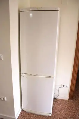 a white refrigerator in a room with at Vacansis Apartamento Florazar 2, 4 in Cullera