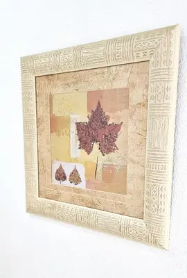 a framed picture of a maple tree with leaves at Vacansis Apartamento Cullera Mar in Cullera