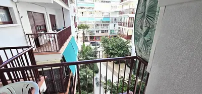 an apartment balcony with a view of a city at Vacansis Apartamento Cullera Mar in Cullera