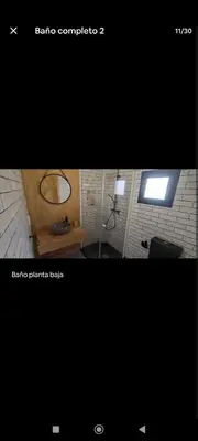 two pictures of a bathroom with a mirror and a room at Casa con piscina junto al mar in El Perellonet