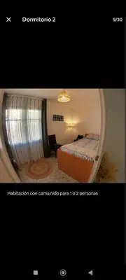 a hotel room with a bed and a window at Casa con piscina junto al mar in El Perellonet
