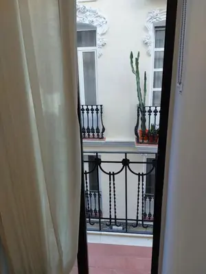 a view of a balcony with a railing and a window at Colomer Silence in Valencia