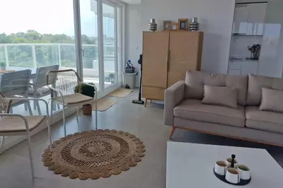 a living room with a couch and a table at Appartement avec vue piscine in Canet de Berenguer