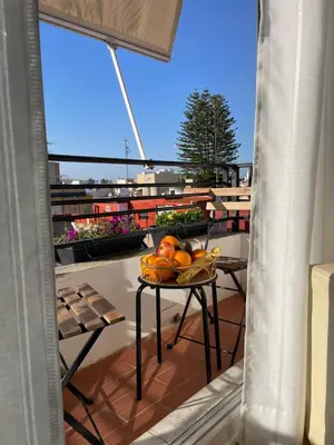 a bowl of fruit on a table on a balcony at Valencia Apartamento Sol de Naranja in Sueca