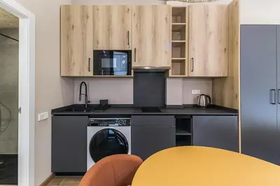 a kitchen with a sink and a stove and a microwave at Premium Suite by the Turia River 3 in Valencia