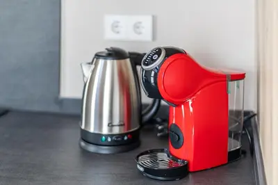 a red coffee maker sitting on top of a counter at Premium Suite by the Turia River 3 in Valencia