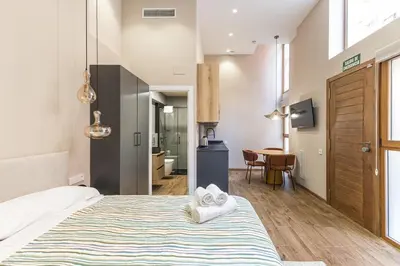 a bedroom with a bed with towels on it at Premium Suite by the Turia River 4 in Valencia