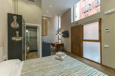 a bedroom with a large bed in a room at Premium Suite by the Turia River 4 in Valencia