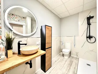 a bathroom with a sink and a mirror at Estudio Benicalap in Valencia