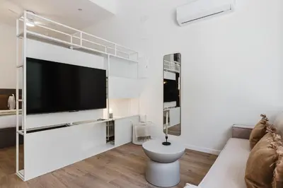a living room with a large flat screen tv at Gran Turia Apartments in Valencia