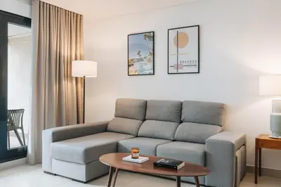 a living room with a couch and a coffee table at White Beach Apartment in Valencia