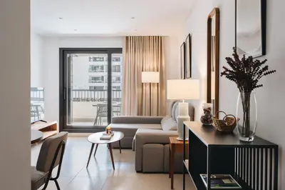 a living room with a couch and a table at White Beach Apartment in Valencia