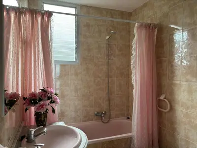 a bathroom with a sink and a bath tub with a shower at Relax & Sea View & Beach Access in Faro de Cullera