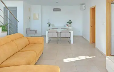 a living room with a couch and a table at 3 Bedroom Beautiful Home In Cullera in Cullera