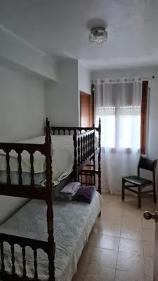 a bedroom with two bunk beds and a window at CANET de BERENGUER in Canet de Berenguer