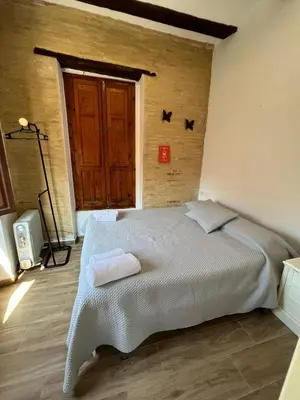 a living room with a couch and a kitchen at Piso 2 - Apartamento Mercado Central in Valencia