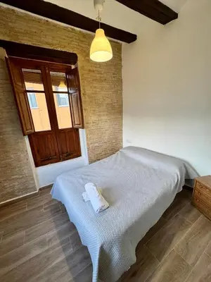 a bedroom with a bed and a window at Piso 3 - Apartamento Mercado Central in Valencia