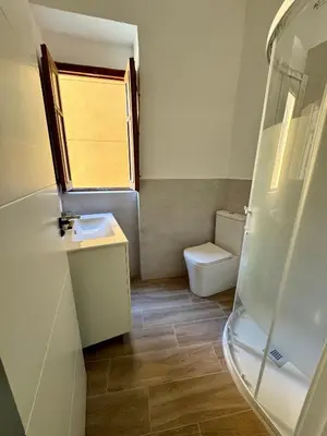 a small bathroom with a toilet and a shower at Piso 3 - Apartamento Mercado Central in Valencia
