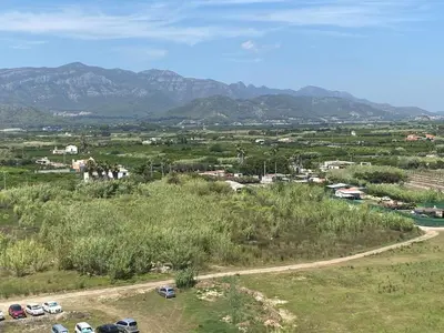a view of a town with mountains in the background at Casa Ivan in Tavernes de Valldigna