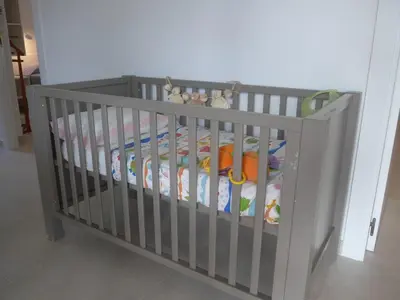 a crib filled with lots of cribding in a room at Casa Kiosko 2 bedroom chalet with swimming pool in La Eliana