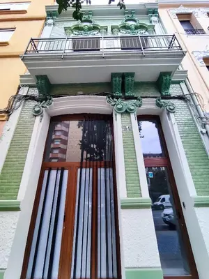 a door to a building with a fence on it at Mandarina Suites - Unique apartments in Valencia in Valencia