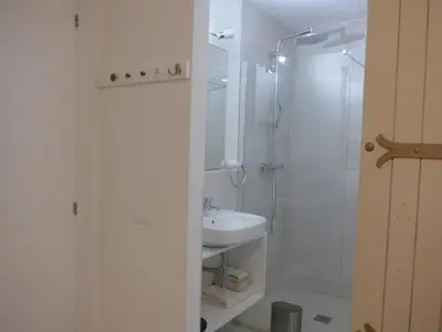 a white bathroom with a sink and a shower at Casa Kiosko 3 bedroom chalet with swimming pool in La Eliana