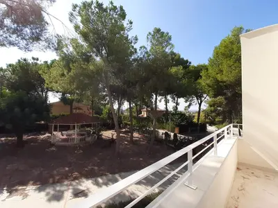 a view from the balcony of a house with trees at Casa Kiosko 3 bedroom chalet with swimming pool in La Eliana
