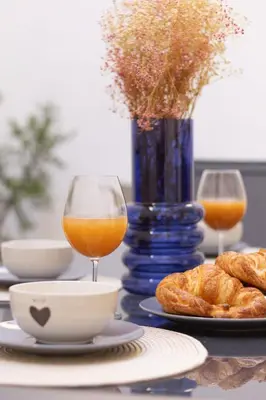 a table with two glasses of orange juice and bread at Casa Montserrat in Valencia