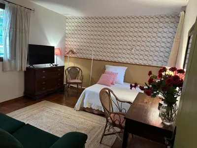 a bedroom with a bed and a table with a tv at El mirador de la Sonora in Artana
