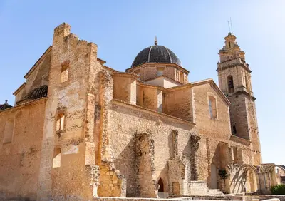 an old building with a clock tower on top of it at Luxury villa close to beach, mountain and golf! in Alzira