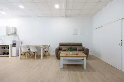 a living room with a couch and a table at Apartamentos Grupo Torres de Quart in Valencia