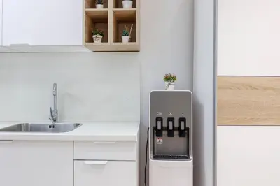 a kitchen with a refrigerator and a sink at Apartamentos Grupo Torres de Quart in Valencia
