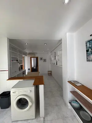 a kitchen with a washing machine in a room at Casa Lúmina Laura-Valencia in Valencia
