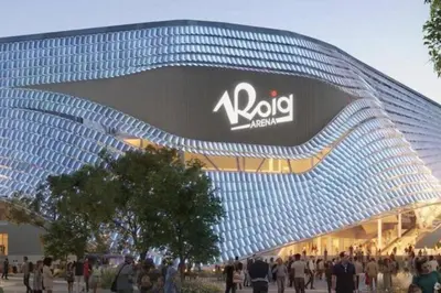 a large building with people standing outside of it at Vlc Yako Suite in Valencia