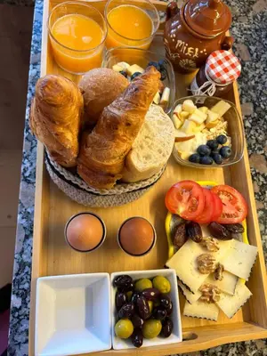 a tray of bread and other food on a table at Finca Malata in Turís