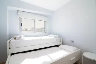a bathroom with a toilet and a sink and a shower at Global Vacacional, Apartamento en primera linea con impresionantes vistas al mar in Canet de Berenguer