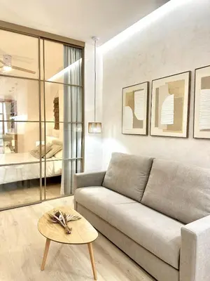 a living room with a couch and a table at Anelsa Suites Serranos 3 in Valencia