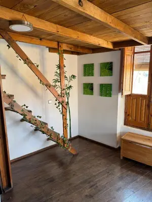 a living room with a spiral staircase in a room at Piso 4 - Apartamento Mercado Central in Valencia