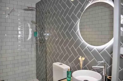 a bathroom with a mirror and a toilet and a shower at Beautiful modern loft 1km from the sea in Valencia in Valencia