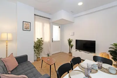 a living room with a couch and a table at GuestReady - Cozy flat in Valencia in Valencia