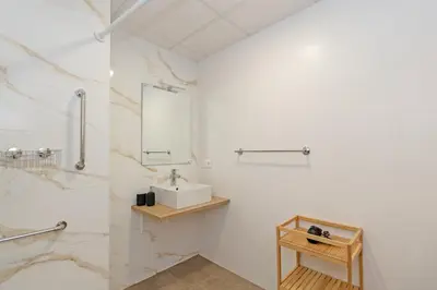 a bathroom with a sink and a mirror at GuestReady - Cozy flat in Valencia in Valencia
