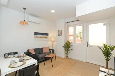 a living room with a couch and a table at GuestReady - Cozy flat in Valencia in Valencia