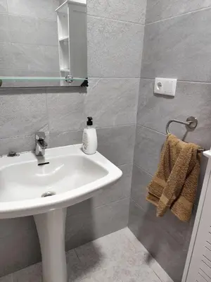 a bathroom with a white sink and a mirror at La Casa de los Alemanes in Gaibiel