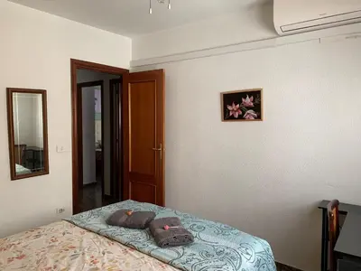 a bedroom with a bed with two pillows on it at Plaza Mare Nostrum 5 min playa in Puerto de Sagunto