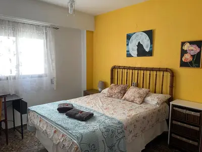 a bedroom with a bed and a window at Plaza Mare Nostrum 5 min playa in Puerto de Sagunto