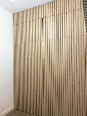 a room with a wooden wall with a sliding door at FALLAS en el barrio del Carmen, el corazón de Valencia in Valencia